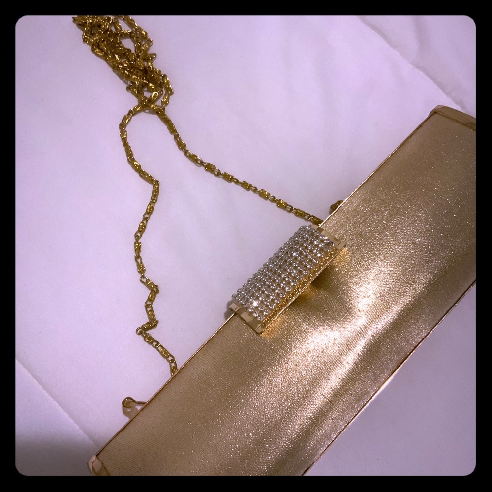 Women’s gold clutch / used once / with gold handle